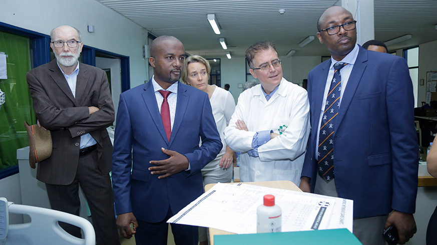 Dr Jules Ndayisaba (L) and Joaquin Bielsa, CEO of Oshen-King Faisal Hospital (C), with other officials during the visit at the hospitalu2019s pediatrics wing. Courtesy.