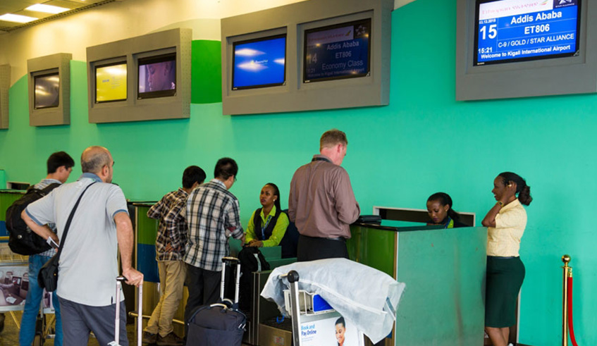 Passengers check in at Kigali International Airport. Rwandau2019s visa openness has promoted the country as a top conference destination. File.