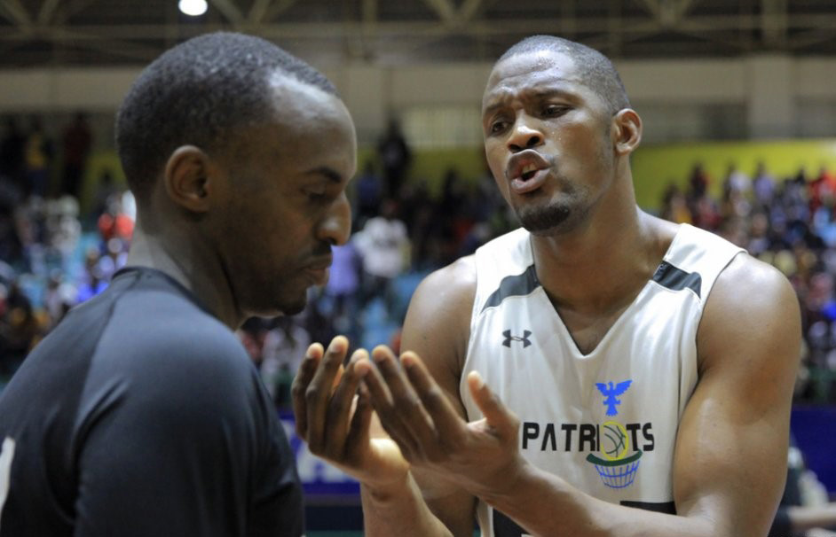 Kenyan power forward Micheal Makiadi (right) contributed 17 points and 10 rebounds to the 105-83 victory over IPRC- Kigali. He is seen here talking to skipper Aristide Mugabe during a time-out in the second quart. / Courtesy
