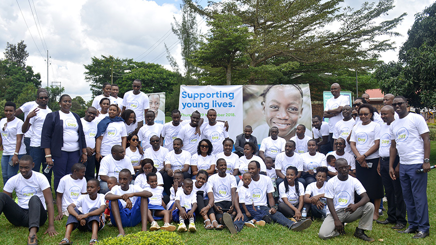 Ecobank Rwanda staff pose for a group photo with Children with Intellecual disabilities at Brothers of Charity HVP Gatagara. All photos by Frederic Byumvuhore.