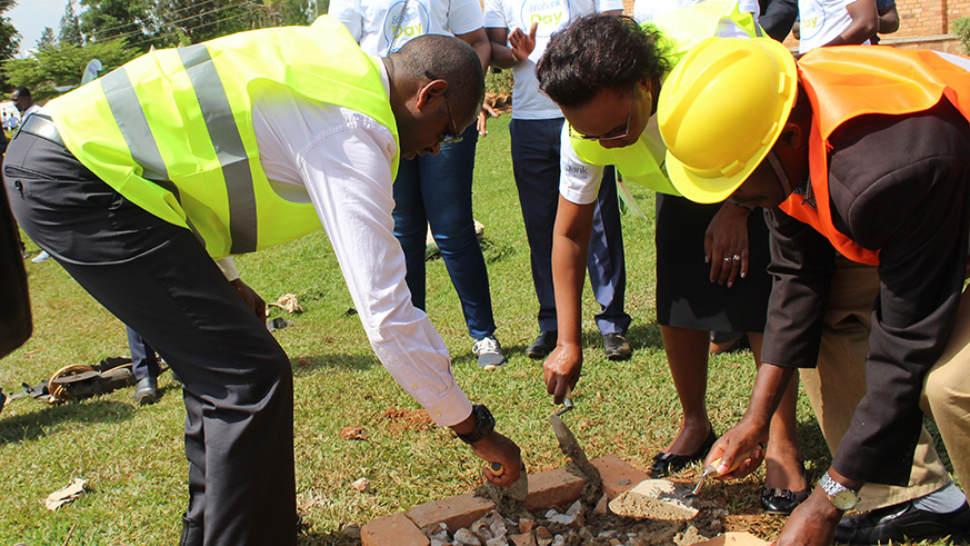EugÃ¨ne Mussolini, the representative for persons with disabilities in the Lower Chamber of Deputies, and Alice Kilonzo Zulu (in a green T-shirts) launch construction activities of the childrenâ€™s room.
