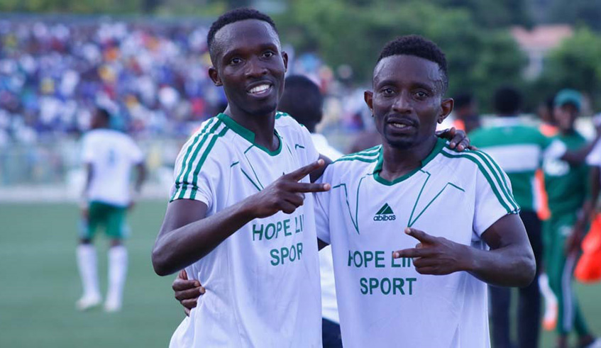 Djuma Nizeyimana (left) is joined by teammate Jean Claude Zagabe to celebrate his double against Rayon Sports at Kigali Stadium on Sunday. Courtesy