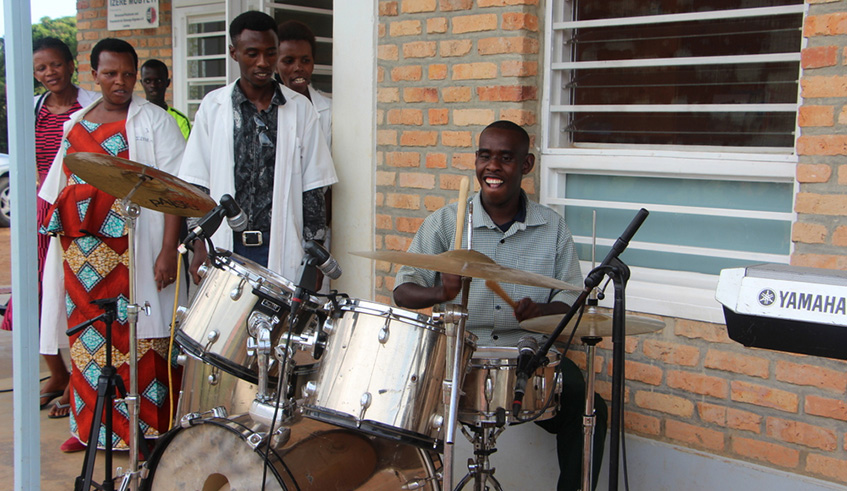 Disability is not inability. A disabled person performs at a previous concert in  Kigali.