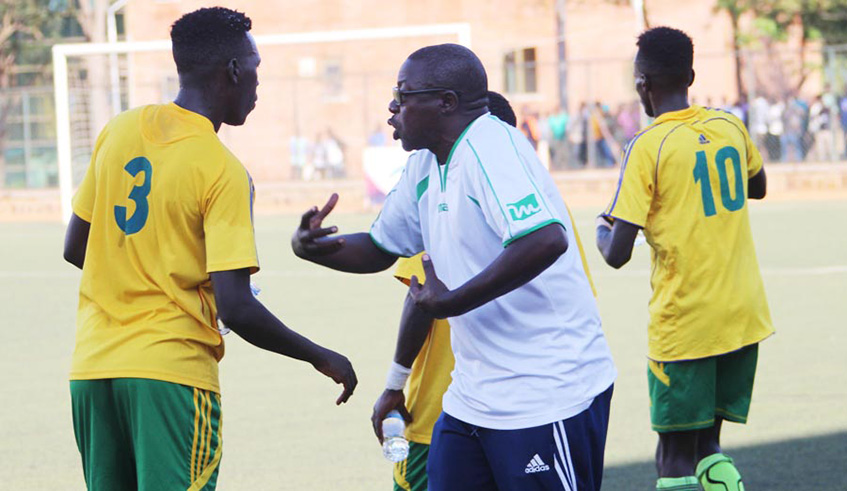 Gicumbi FC head coach Abdou Bizimanabriefs his players during a past league match at Kigali Stadium. Courtesy.