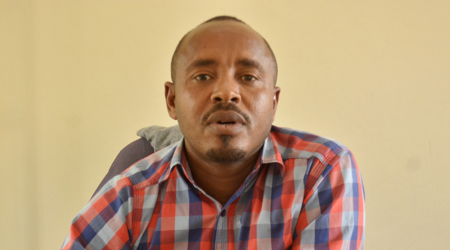 Alex Bucyana, the in charge of Placement and partnership officer at Kigali Employment Service center during an interview. / Frederic Byumvuhore
