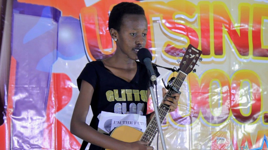 17 year-old singer and guitarist Ange Rita Kagaju performs during last yearu2019s auditions. Courtesy photos