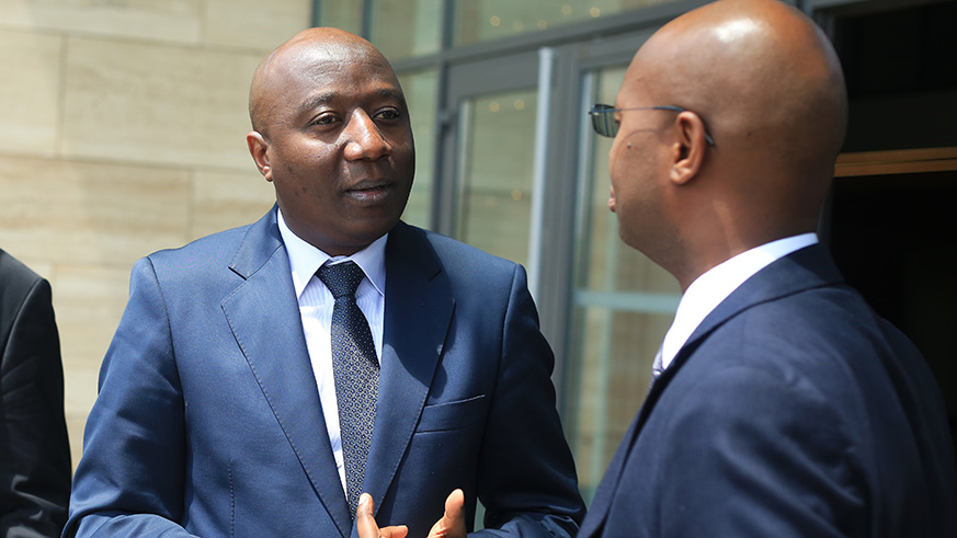 Ngirente shares ideas with  National Institute of Statistics of Rwanda Director General Yusuf Murangwa after the official launch(Sam Ngendahimana)