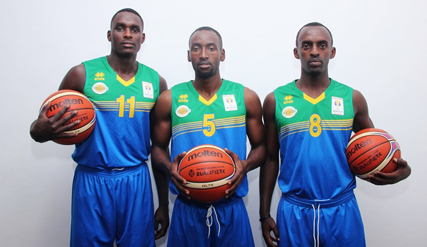 Pascal Niyonkuru (#11) has on several occassions been named in provisional squads of the senior national team but often struggled to make it to the final team. In the photo, he is with National skipper Aristide Mugabe (R) and Ali Kazingufu. Courtesy.