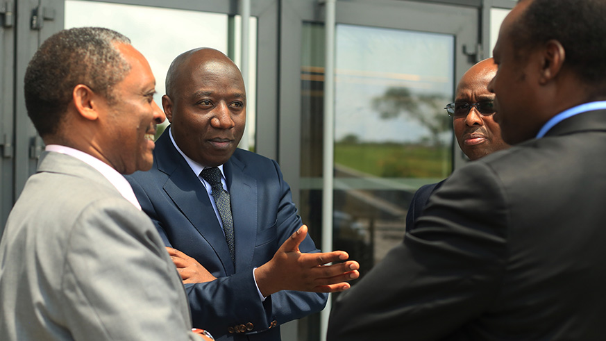 Prime Minister Edouard Ngirente in a conversation with Local Government Minister Shyaka (left), Finance Minister Uzziel Ndagijimana (right) and National Institute of Statistics of Rwanda boss Yusuf Murangwa after the official launch of the report at Kigali Convention Centre yesterday. STORY ON PAGE 5. Sam Ngendahimana.