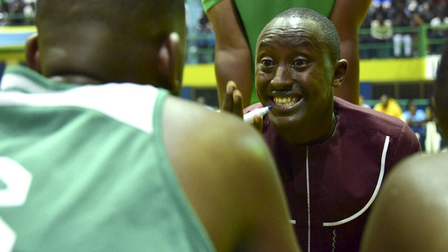 Espoir head coach Maxime Mwiseneza shouts instructions to his players during the 74-61 defeat at the hands of REG at Amahoro Indoor Stadium on Friday. Courtesy .