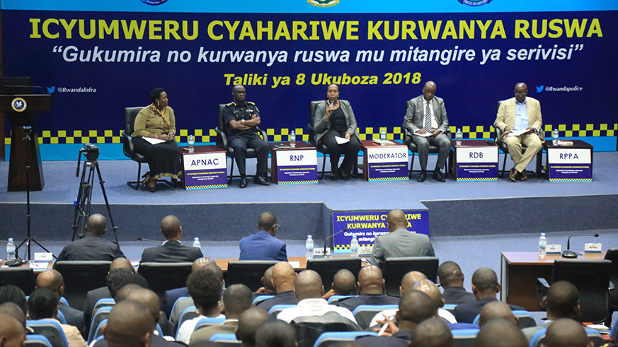 A cross section of officials in a panel discussion during the conference organised in line with anti-corruption week .  Held on Saturday at Rwanda National Police General Headquarters, the meeting was under the theme u2018fighting corruption in service deliveryu2019. Sam Ngendahimana.