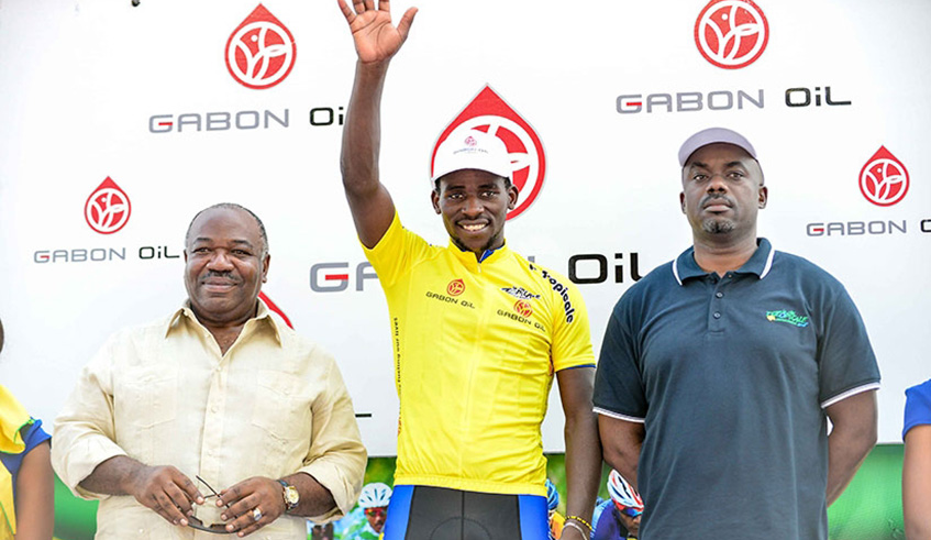 Joseph Areruya is joined on the podium by Gabonese President, Ali Bongo Ondimba (L), after he was crowned the champion of the 2018 La Tropicale Amissa Bongo in January. File photo.
