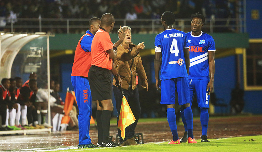 Head coach the Brazilian Roberto gives instruction to his players during the match