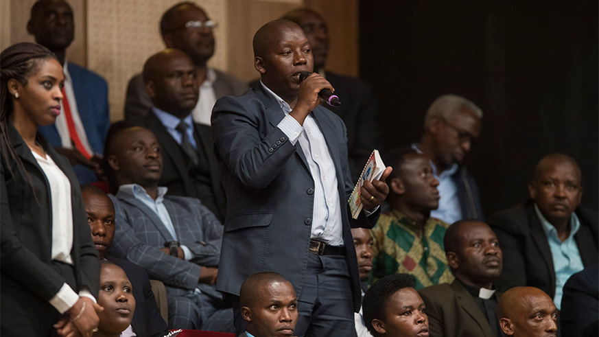 A participant poses a question during the Umushyikirano at Kigali Convention Centre yesterday. Village Urugwiro.