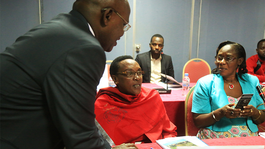 The Executive Secretary of Transparency International Rwanda (TI-RW) Appolinaire Mupiganyi (left) speaks to TI-RW chairperson Marie-Immaculu00e9e Ingabire (centre) and State Minister for Social Affairs Alvera Mukabaramba during the launch of the report in Kigali on Wednesday. Sam Ngendahimana.