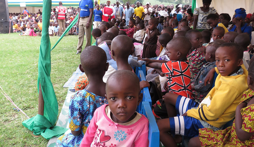 Officials give milk to children