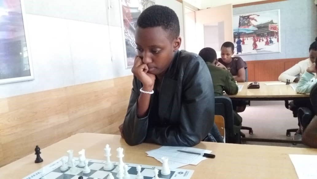 LNDC chess club captain, Anna Ngarambe, is buoyed to surprise champion Sandrine Uwase on Sunday afternoon. Courtesy