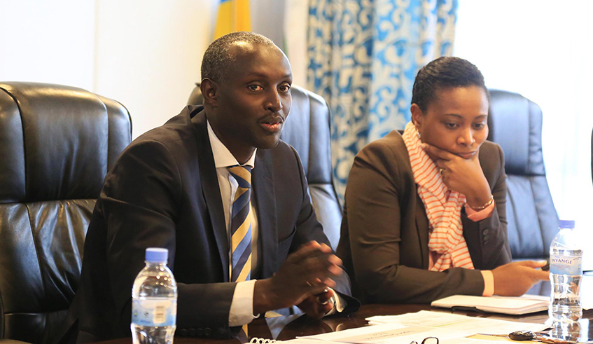 The Export Investments Senior Manager at BRD, Benjamin Manzi addresses MPs as Lilliane Gihozo Uwera, Chief Operations Officer of BRD, looks on yesterday. Photos by Sam Ngendahimana.