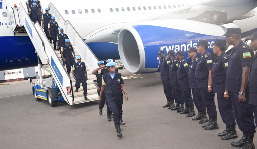 IGP Dan Munyuza briefs the departing police peacekeepers yesterday. Courtesy.