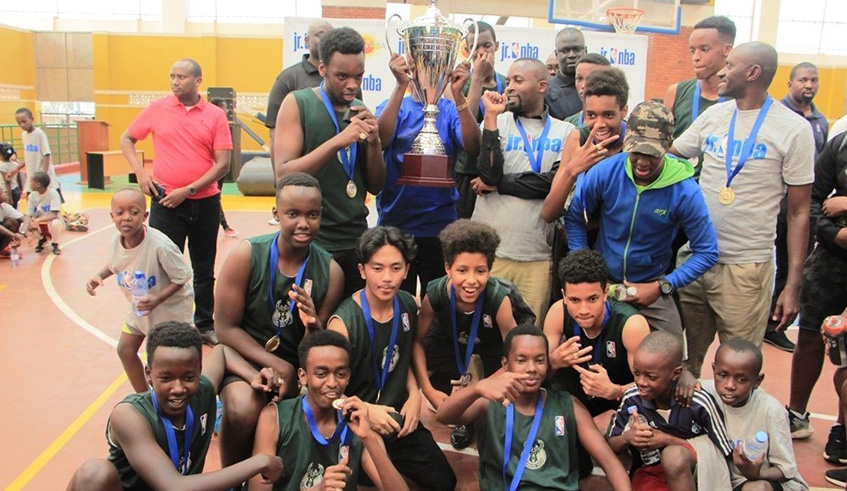 Green Hills Academy players and coaching staff celebrate after beating Sonrise to lift the inaugural Junior NBA Rwanda Leagueâ€™s title in boysâ€™ category at Amahoro Stadium . Courtesy.