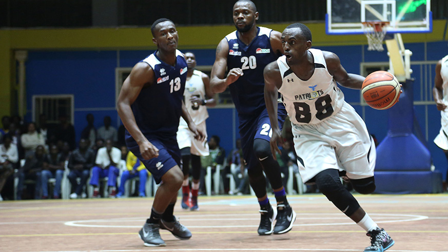 Rwanda international and Patriots skipper Aristide Mugabe dribbles past REGu2019s Kami Kabange (middle) and Elie Kaje (left) during semi-finals of the preseason tournament at Amahoro Stadium last month. Sam Ngendahimana.