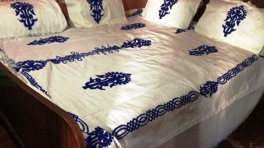 Bedcover made with a touch of crochet. 