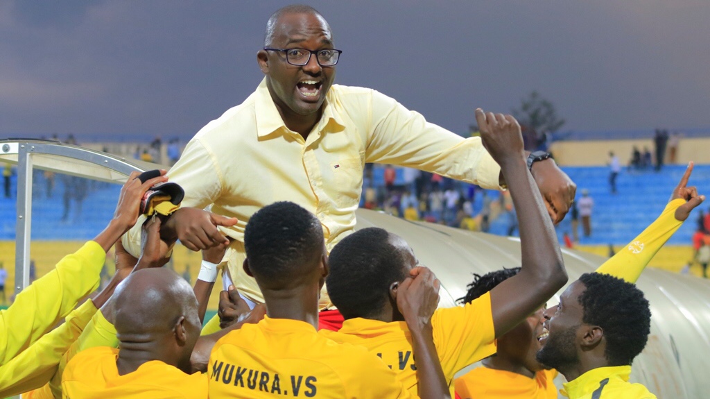 Head coach Francis Christian Haringingo and his Mukura players celebrate after beating Hilal Obayed 5-4 in panalties to reach the playoffs round in Caf Confederation Cup for a historic first time at Huye Stadium on Saturday. Courtesy