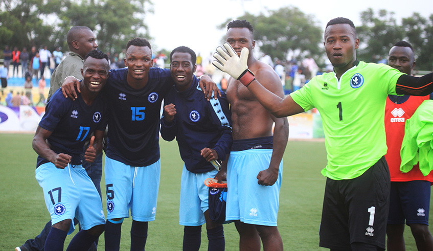 Police FC striker Peter Otema (left) celebrates with his teammates after beating Rayon Sports 1-0 at Kigali Stadium last Friday. The law enforcers are in second position with 20 points, five behind leaders, and still unbeaten, APR. Sam Ngendahimana