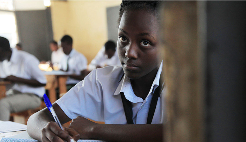 Students sit O-Level examination at Remera Secondary School recently. Sam Ngendahimana.