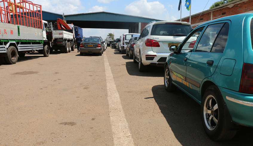 Rwanda National Police technician inspects a vehicle through a computer. Courtesy. 