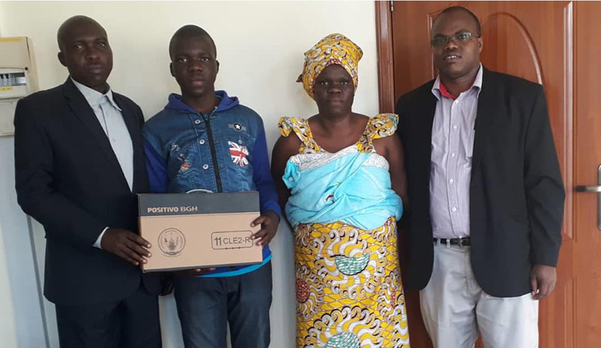 L-R:  Philippe Munyezamu, Christian Ishimwe (centre)'s father, Jacqueline Nyirambarushimana, his mother, and the Head Teacher of Ecole des Sciences de Byimana, Father Crescent Karerangabo in Kigali on Monday. / Courtesy