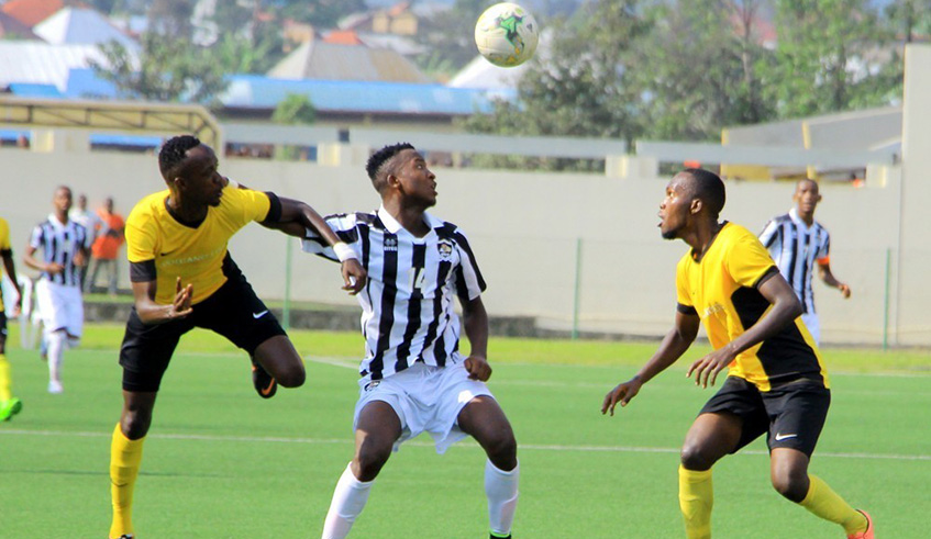 APR striker Lague Byiringiro (M) vies for the ball with Mukura players Janvier Mutijima (L) and Saidi Iragire during the Super Cup clash at Umuganda Stadium last October, which ended 2-0 in favour of APR. File.