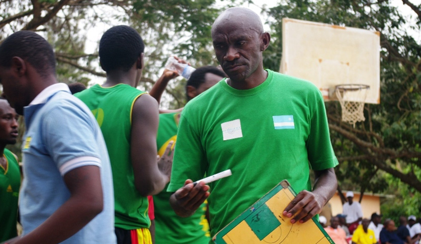 IPRC-Kigali head coach Albert Buhake is seen here talking to his players during a past league match against Patriots. File.