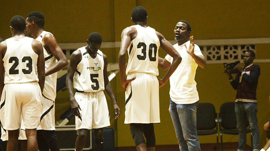 Patriots coach Henry Mwinuke  gives instructions to his players during a past league match against REG at Amahoro Stadium. Sam Ngendahimana.