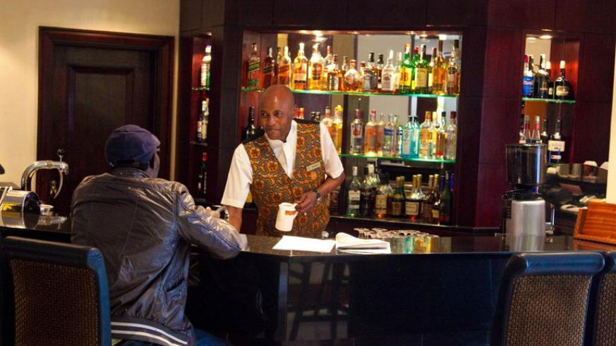 A waiter attends to a customer at the Kigali Serena Hotel. File photo