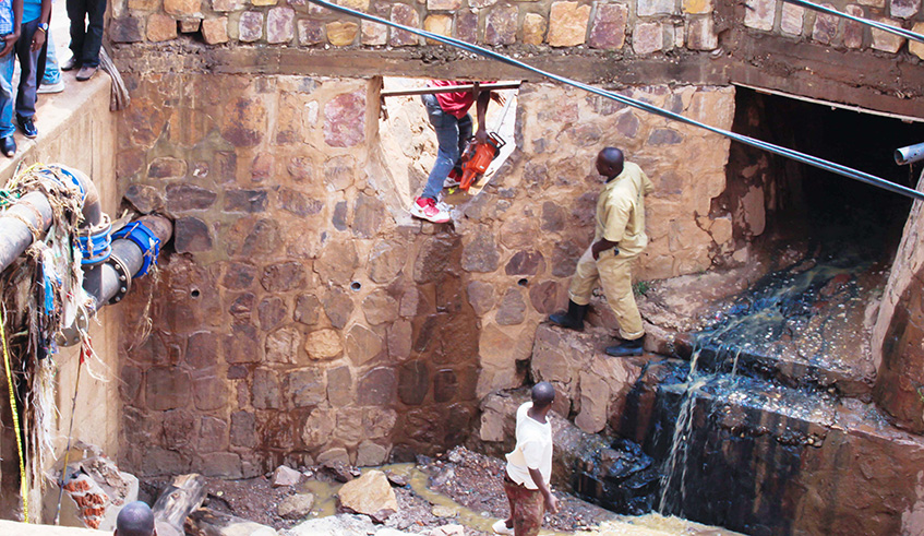 People clean a drainage in Nyabugogo area. Last year, the Government secured u20ac96 million for the first ever Kigali Sanitation and Central Sewerage System. File.