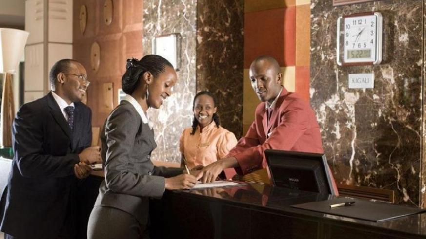 Guests being served at a front desk at a Kigali hotel. (Net photo)