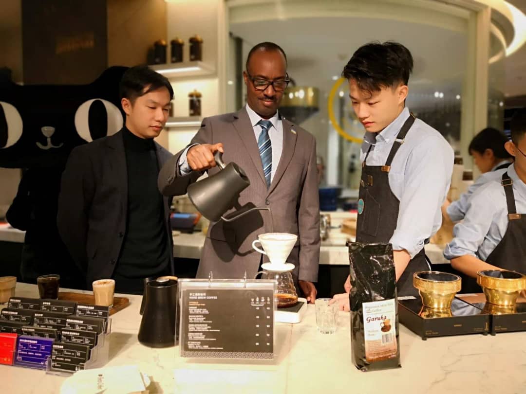 Rwanda's ambassador to China showcasing Rwandan coffee to Chinese consumers during the event in Shanghai. / Courtesy