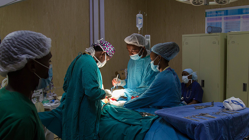 A team of doctors operate on a patient at Rwanda Military Hospital-Kanombe Yesterday. The new facility will help increase the number of plastic surgeons in the country. Nadege Imbabazi.