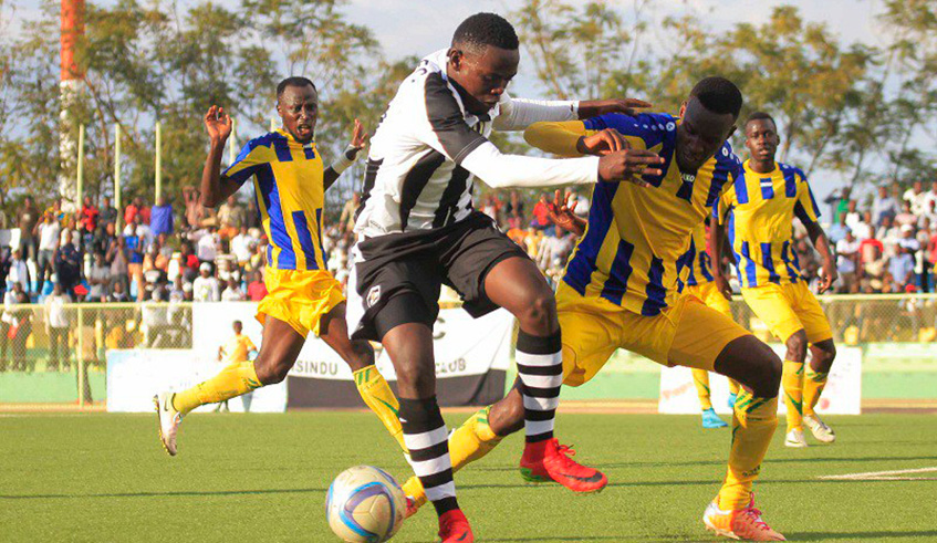 APR forward Muhadjiri Hakizimana (in black & white) vies for the ball with former AS Kigali skipper Soter Kayumba during a past league match at Kigali Stadium. Center-back Kayumba has since joined Kenyan side Sofapaka. File.