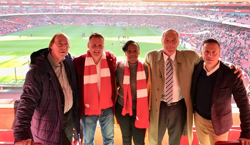 SKOL Brewery Rwanda General  Manager Ivan Wulffaert (2nd left) and Marketing Director Anita Haguma (C), pose with Arsenal officials at Emirates Stadium after signing the partnership deal in December. Courtesy photo.