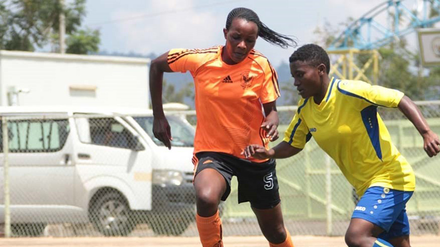 Scandinavia defender Edithe Umulisa (left) vies for the ball with AS Kigali forward Dorothea Mukeshimana during a past league match at Kigali Stadium. File.