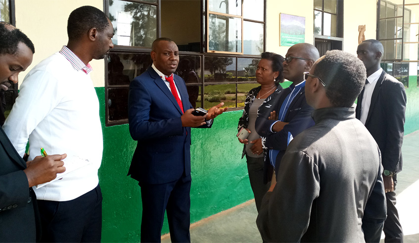 Munyakazi (Centre) with other officials inspect Saint Andre school on Day I of the 2019 academic year yesterday. Jean du2019Amour Mbonyinshuti.