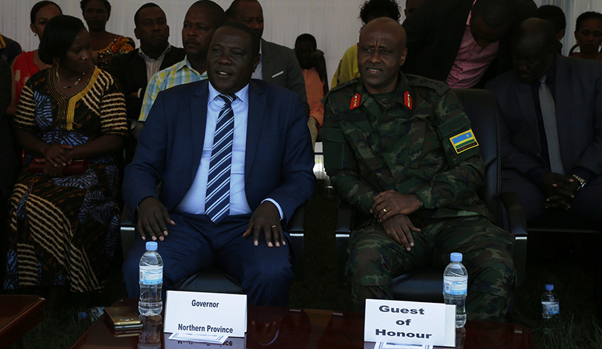 Governor of the Northern Province, JMV Gatabazi (c) and the commandant of the Rwanda Defence Force Command and Staff College Maj. Gen Jean Bosco Kazura during cultural day event. Regis Umurengezi