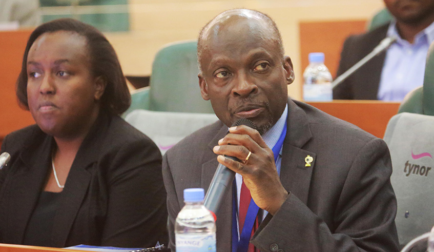 University of Rwandau2019s Deputy Vice-Chancellor in charge of Academic Affairs, Nelson Ijumba, addresses the Senate as Deputy Vice-Chancellor in charge of Finance, Franu00e7oise Kayitare Tengera, looks on yesterday. The university has outlined a five-year plan of how to pay Rwf14 billion it owes to different suppliers and some members of its staff. Sam Ngendahimana.