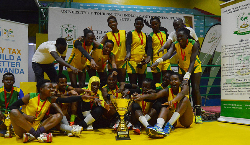 UTB Womenu2019s Volleyball Club players celebrate with their trophy after overcoming RRA to win the preseason tournament at Amahoro Stadium on Sunday. Courtesy.