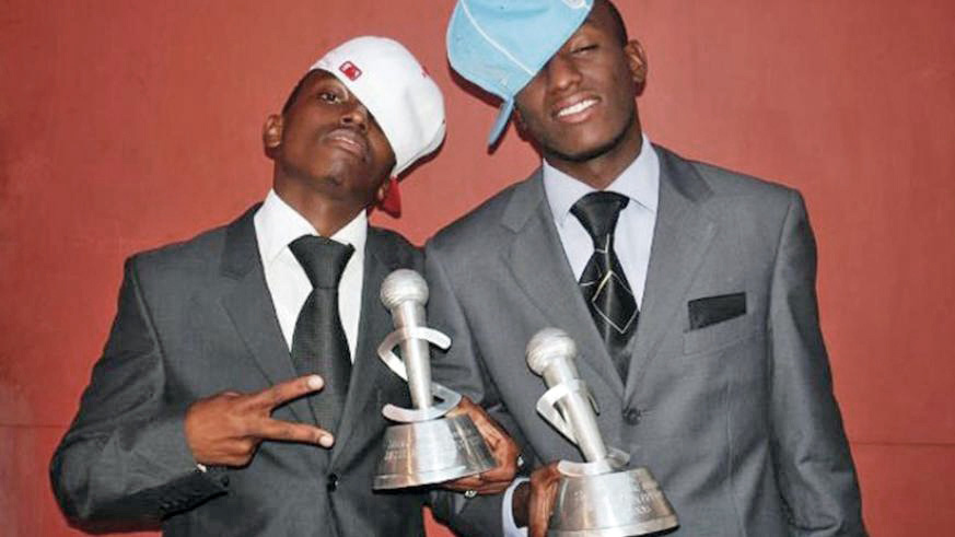 Tom Close (L) and The Ben pose with awards.  Right: The Salax awards. 