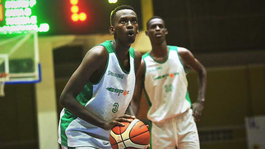 Shooting guard Armel Sangwe (with a ball), and skipper Emile Galois Kazeneza will lead Espoir chase for a win over IPRC-Kigali on Friday. Sam Ngendahimana.