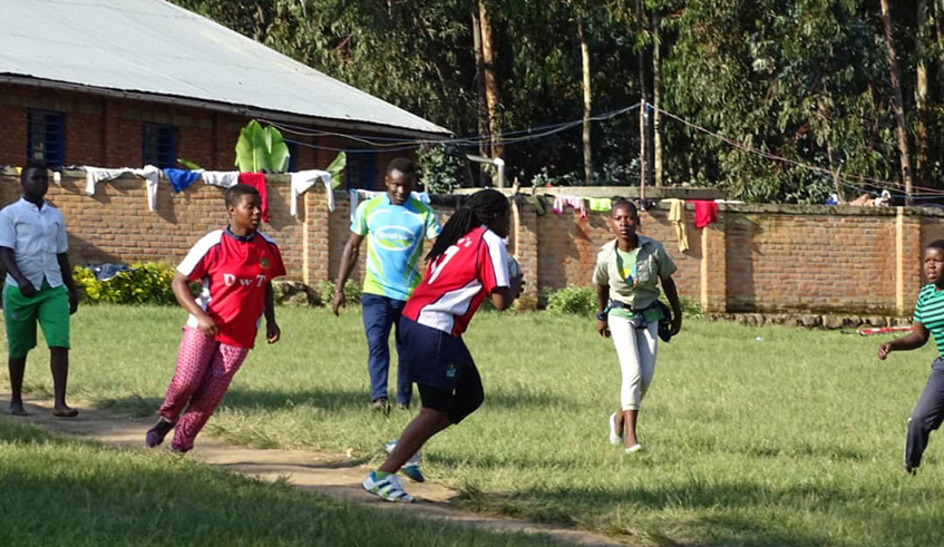 Ernestine Ibemaso (with the ball) during a past training session with members of her rugby academy in Musanze District. Jejje Muhinde.