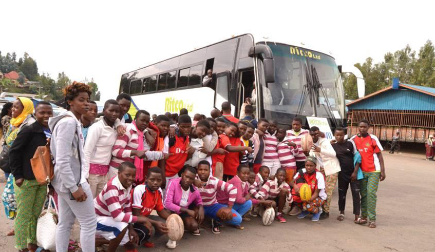 Ernestine Ibemaso (left) poses for a group photo with trainees of her Gorilla Girls Rugby Academy. Jejje Muhinde.